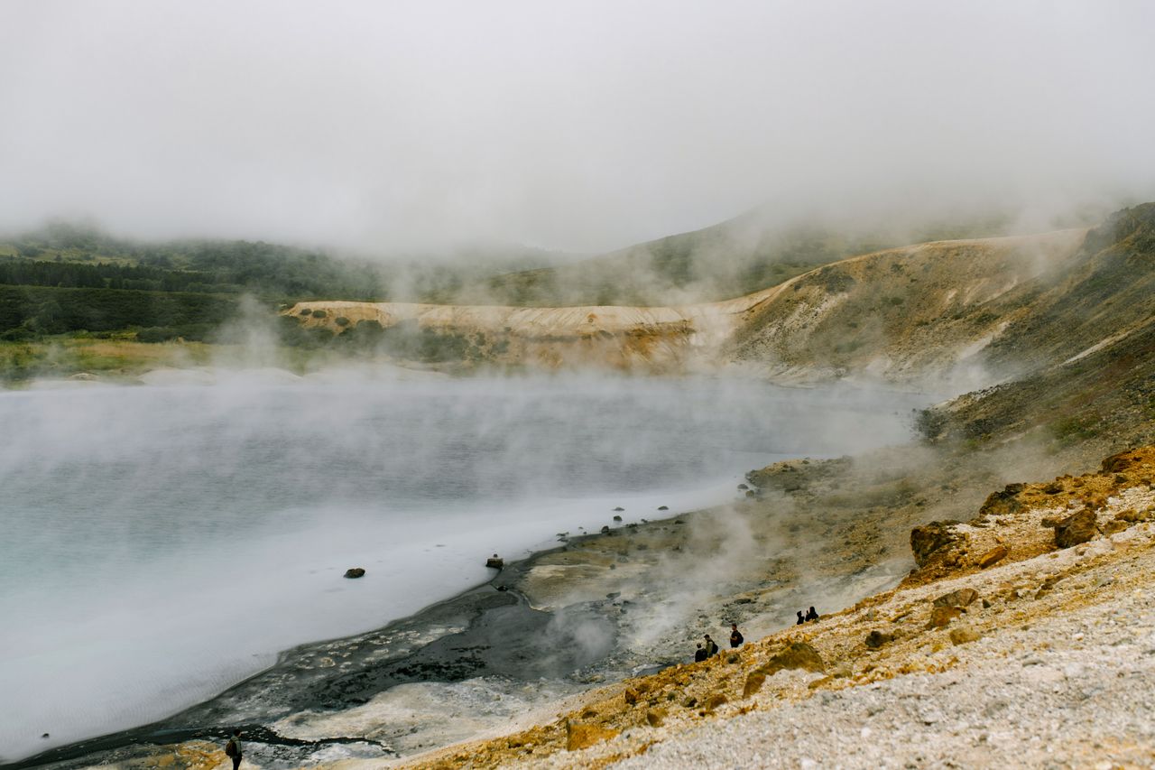 Steam rising over a natural hot spring